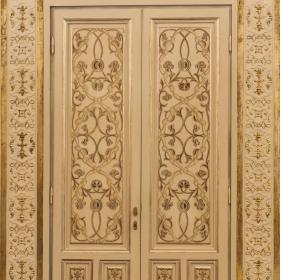 Door of the Mirrors' Room with golden arabic decorations